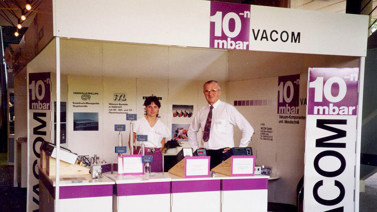 VACOM exhibition stand with employees