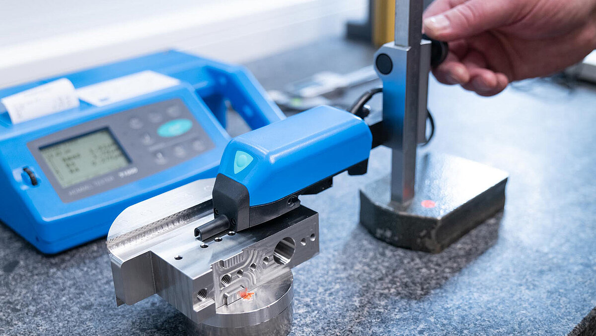 Surface Roughness Measurement; An employee measures the surface of a product