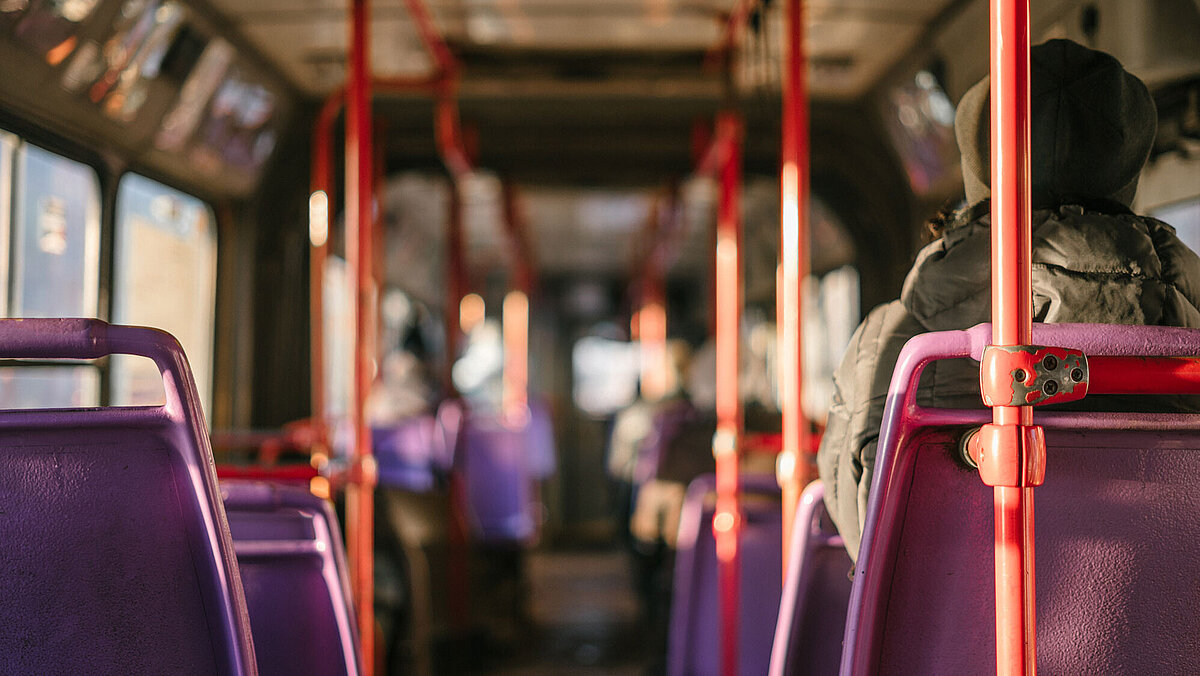 https://unsplash.com/photos/lr9vo8mNvrc Jobticket Benefits; A view through a bus in which people are sitting