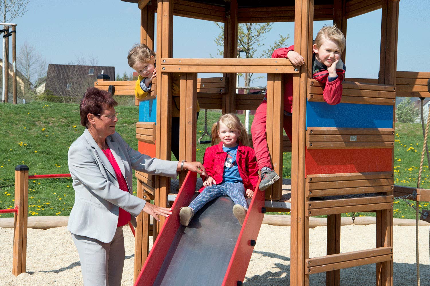 Company founder Dr Ute Bergner with children in the playground